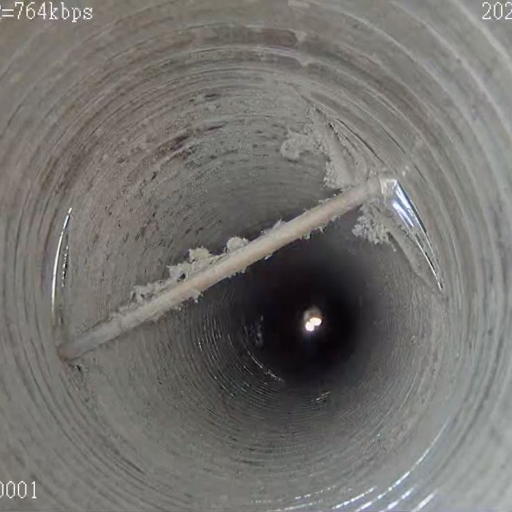 Gas pipe through flue